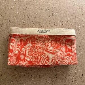 L'Occitane Red orangey and Cream Cosmetic Bag aesthetic modern